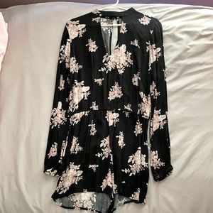This is a black long sleeve romper size medium.